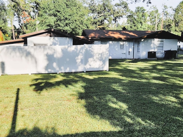 view of yard with central AC unit