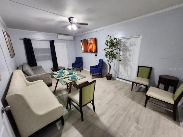 living room featuring ceiling fan, light wood-type flooring, crown molding, and a wall mounted air conditioner