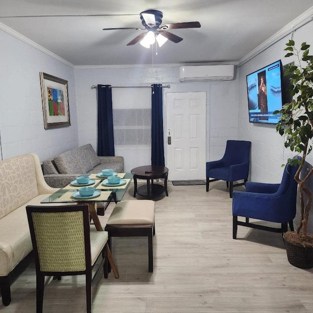 living room featuring light hardwood / wood-style floors, a wall unit AC, ceiling fan, and crown molding