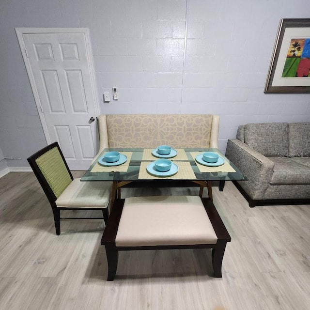 dining area with hardwood / wood-style floors