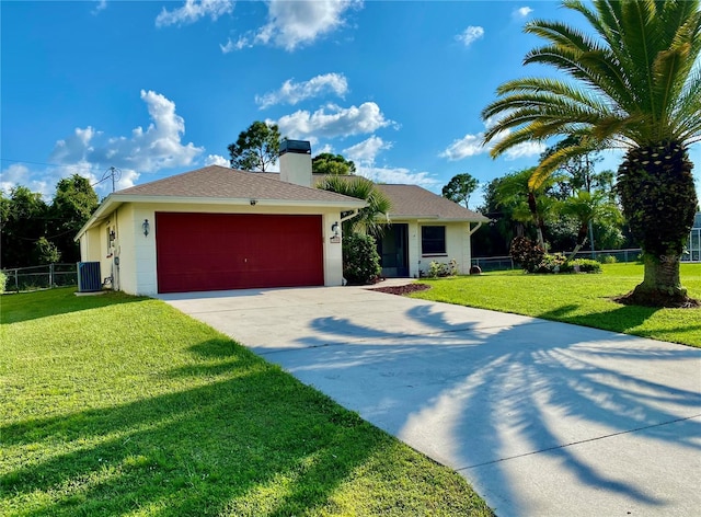 ranch-style home featuring central AC unit, a garage, and a front lawn