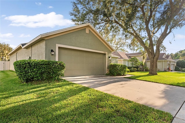 ranch-style home featuring a garage and a front yard