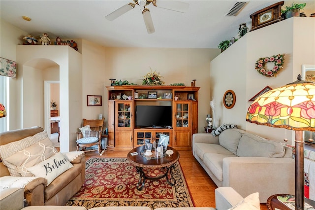 living room with light wood-type flooring and ceiling fan