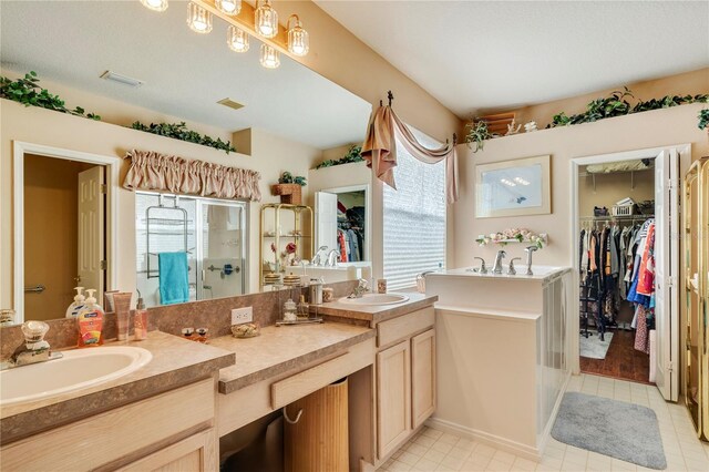 bathroom with vanity and an enclosed shower