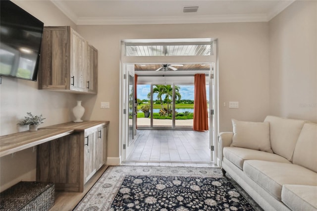 tiled living room featuring ornamental molding