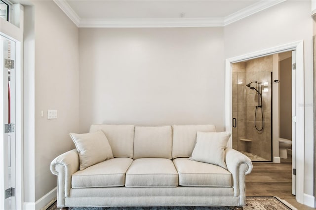 living room with crown molding and hardwood / wood-style flooring