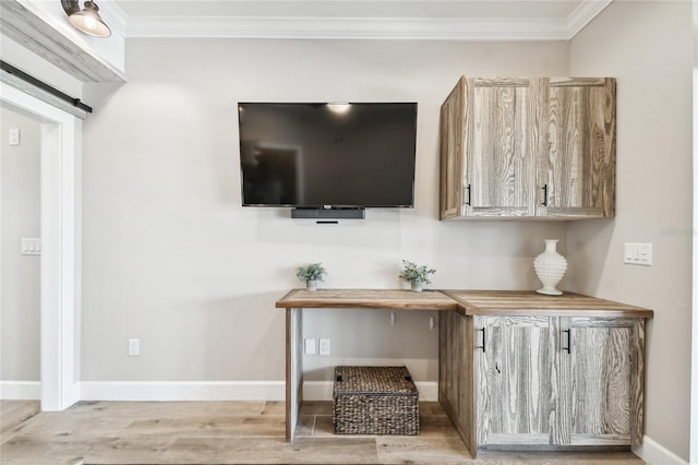 interior space with wood-type flooring and crown molding