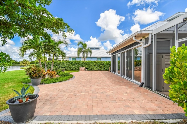 view of patio with a water view