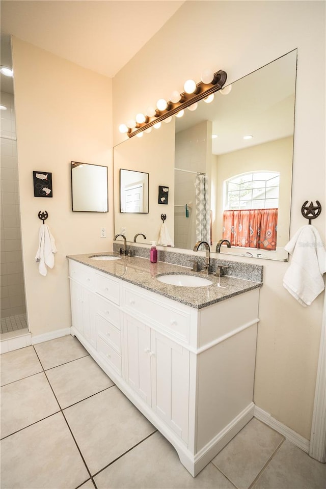 bathroom featuring tile patterned floors, walk in shower, and vanity