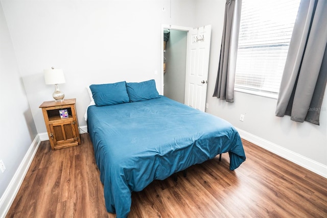 bedroom featuring dark hardwood / wood-style flooring