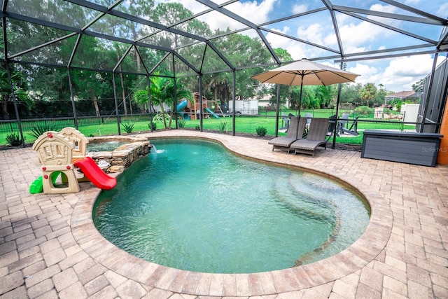 view of pool with a lanai, a patio, a playground, and a yard