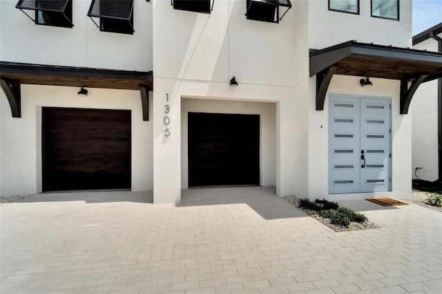 property entrance with a garage