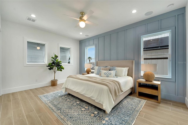 bedroom with light wood-type flooring and ceiling fan