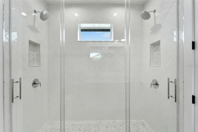 bathroom with a shower with shower door