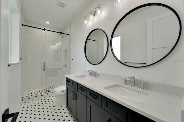 bathroom with vanity, tile patterned flooring, an enclosed shower, and toilet