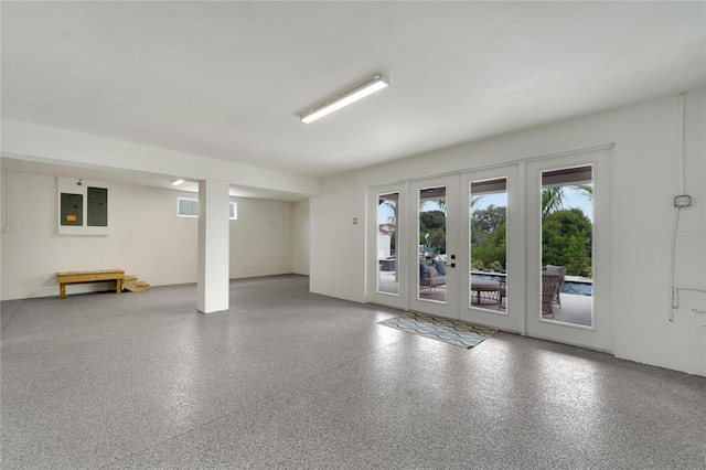 interior space with electric panel and french doors