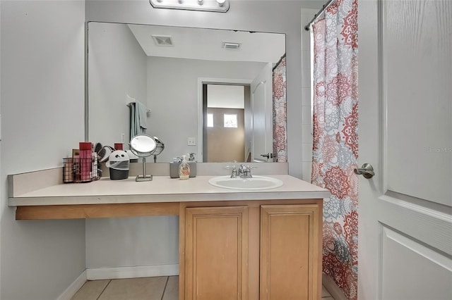 bathroom with vanity and tile patterned floors