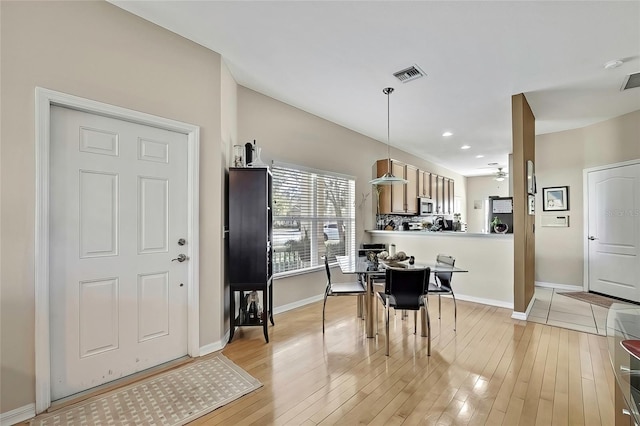 20308 Oak Key Ct, Tampa, FL 33647 - dining room featuring light wood-type flooring, baseboards, and recessed lighting