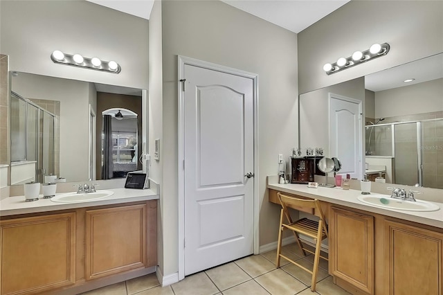 20308 Oak Key Ct, Tampa, FL 33647 - bathroom with a shower stall, tile patterned flooring, and two vanities
