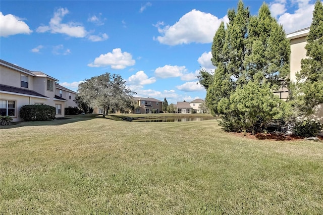 20308 Oak Key Ct, Tampa, FL 33647 - view of green lawn with a residential view and a water view