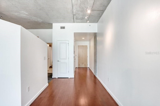 corridor featuring wood-type flooring