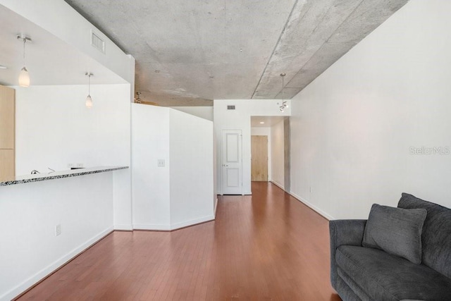 unfurnished living room with hardwood / wood-style flooring