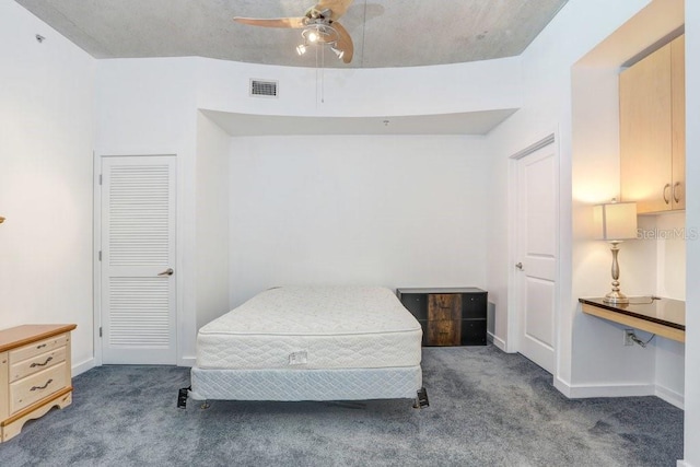 carpeted bedroom with ceiling fan