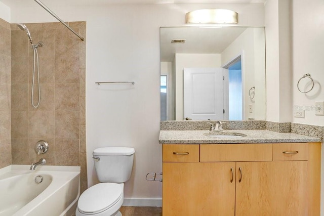 full bathroom featuring vanity, toilet, and tiled shower / bath combo