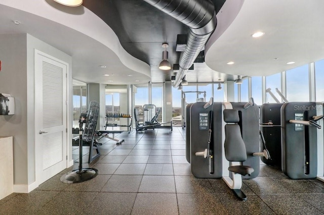 workout area featuring floor to ceiling windows