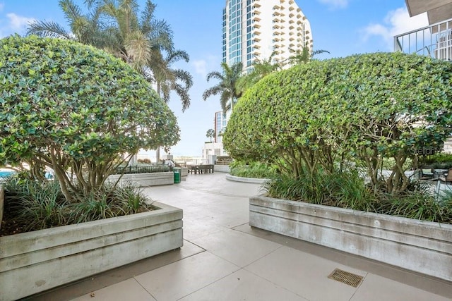 surrounding community with a patio area