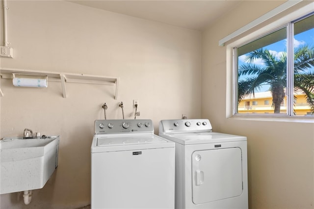 laundry area featuring washer and dryer and sink