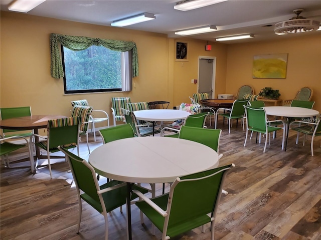 dining space with wood-type flooring