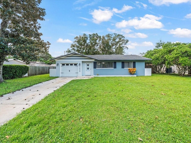 ranch-style home with a garage and a front yard