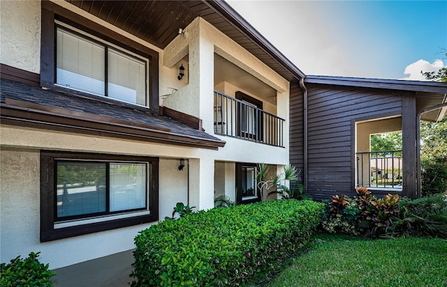 view of home's exterior with a balcony