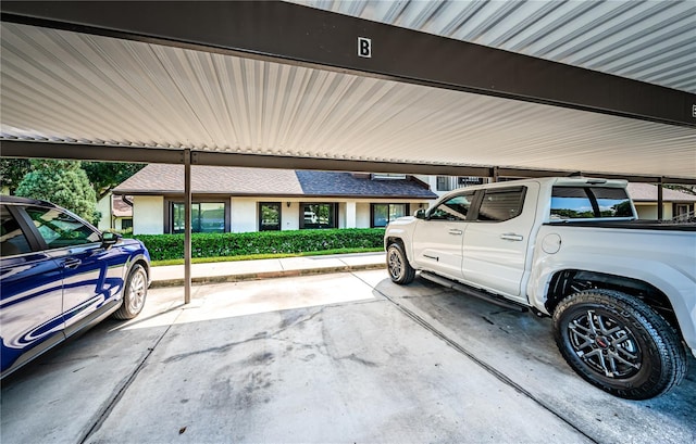 garage featuring a carport