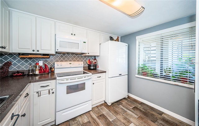 kitchen featuring white appliances, white cabinetry, dark hardwood / wood-style floors, and tasteful backsplash