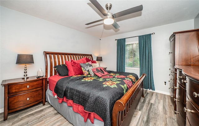 bedroom featuring light wood-type flooring and ceiling fan