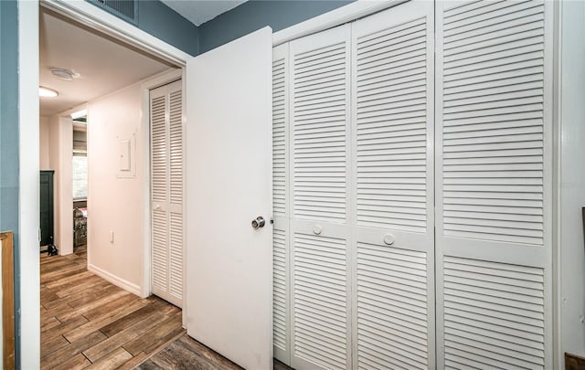 hallway featuring dark hardwood / wood-style floors