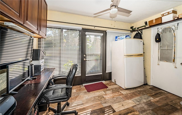 home office featuring wood-type flooring and ceiling fan