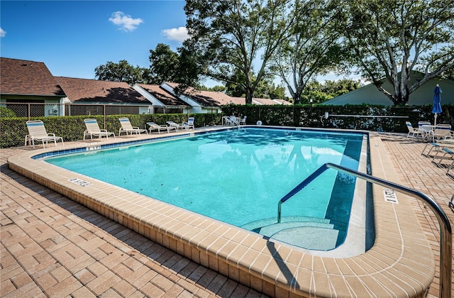 view of swimming pool with a patio area