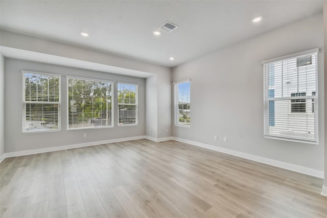 unfurnished room with light hardwood / wood-style flooring