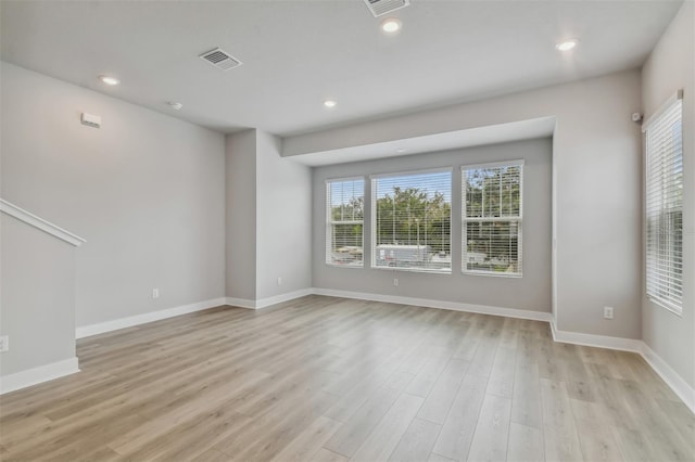 unfurnished living room featuring light wood-type flooring