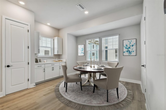 dining area featuring a healthy amount of sunlight and light hardwood / wood-style floors