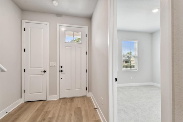 entrance foyer with light wood-type flooring and a wealth of natural light