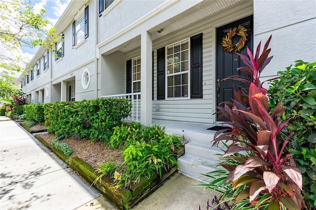 entrance to property with a porch