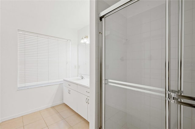 bathroom with vanity, tile patterned floors, and a shower with shower door