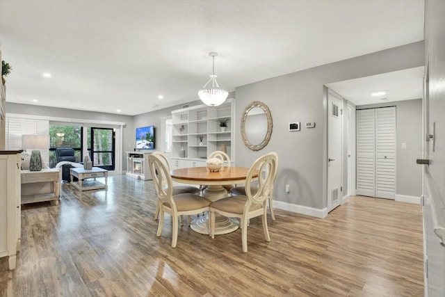 dining area with light hardwood / wood-style floors