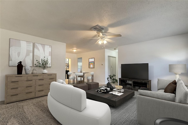 living room with ceiling fan, a textured ceiling, and carpet floors