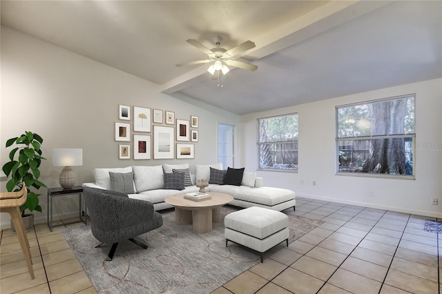 living room featuring lofted ceiling, light tile patterned flooring, and ceiling fan