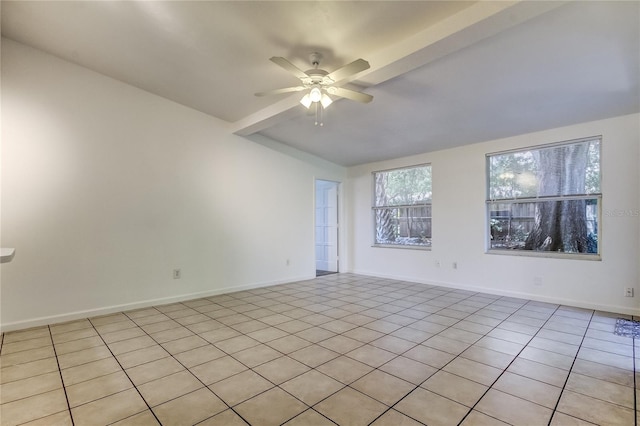 tiled empty room featuring ceiling fan